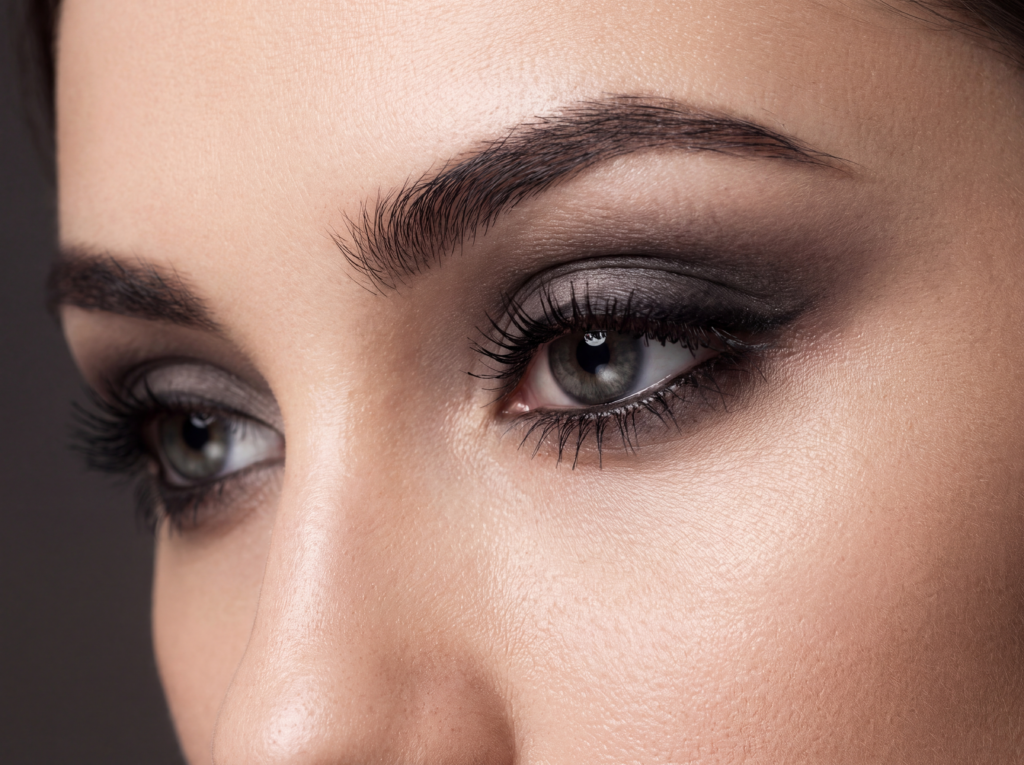 Close-up of soft gothic eye makeup with charcoal shadow and black liner